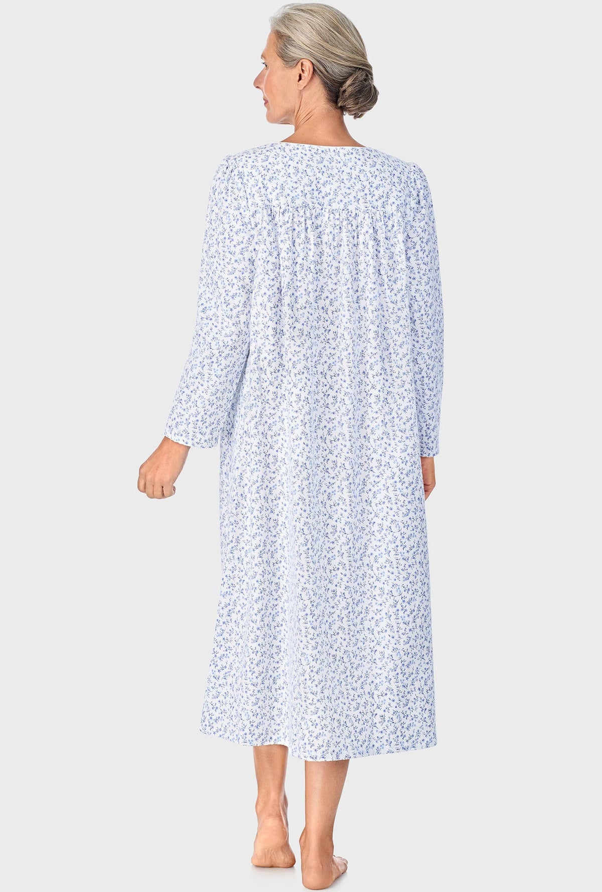 A lady wearing Serenity Blue Floral Long Sleeve Nightgown