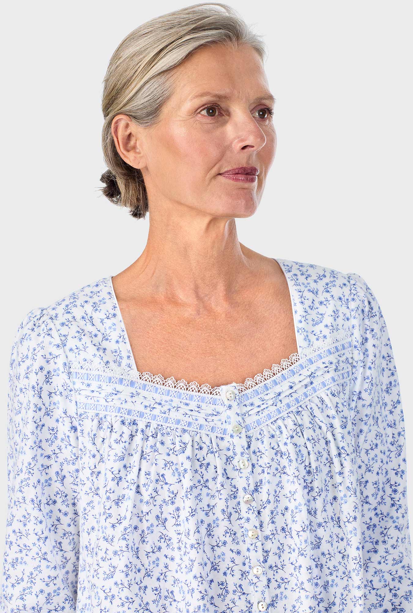 A lady wearing Serenity Blue Floral Long Sleeve Nightgown