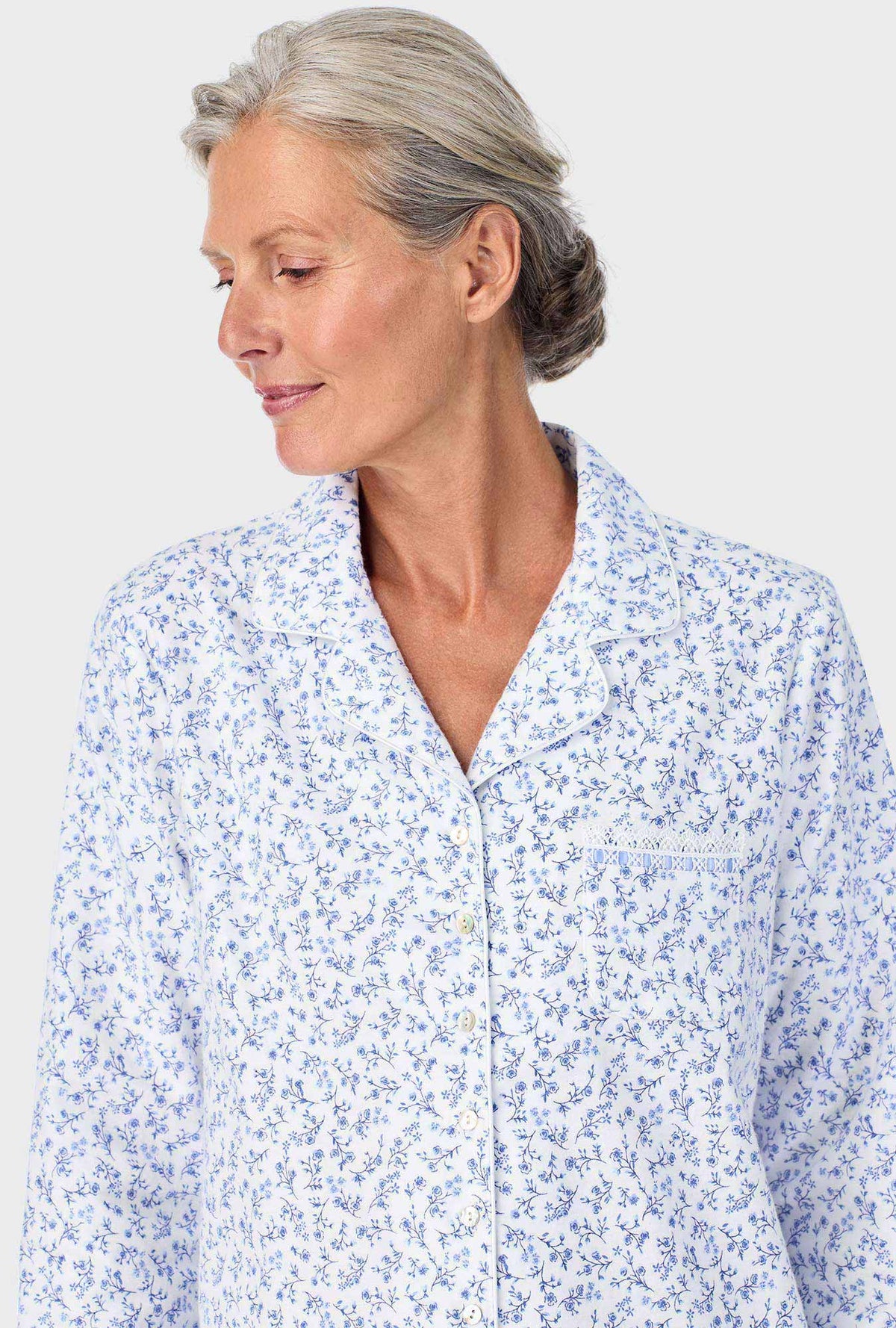 A lady wearing Serenity Blue Floral Notch Collar PJ Set