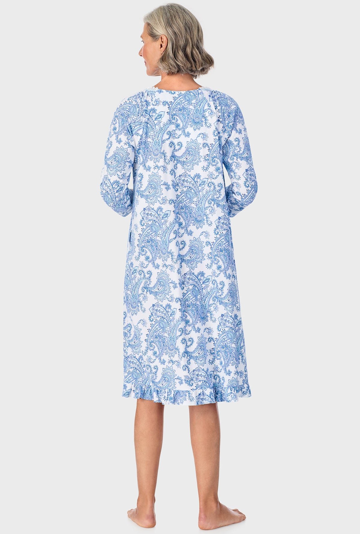 A lady wearing blue quarter sleeve nightgown with cool multi paisley print.